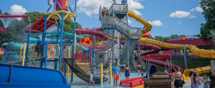 Landscape shot of Quassy Water Park with people, showing various water slides and Saturation Station